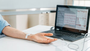 Patient hand with sensors attached for biofeedback